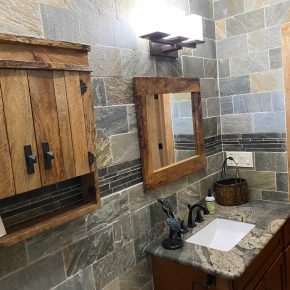 Forest Room Bathroom vanity with granite countertop and mirror